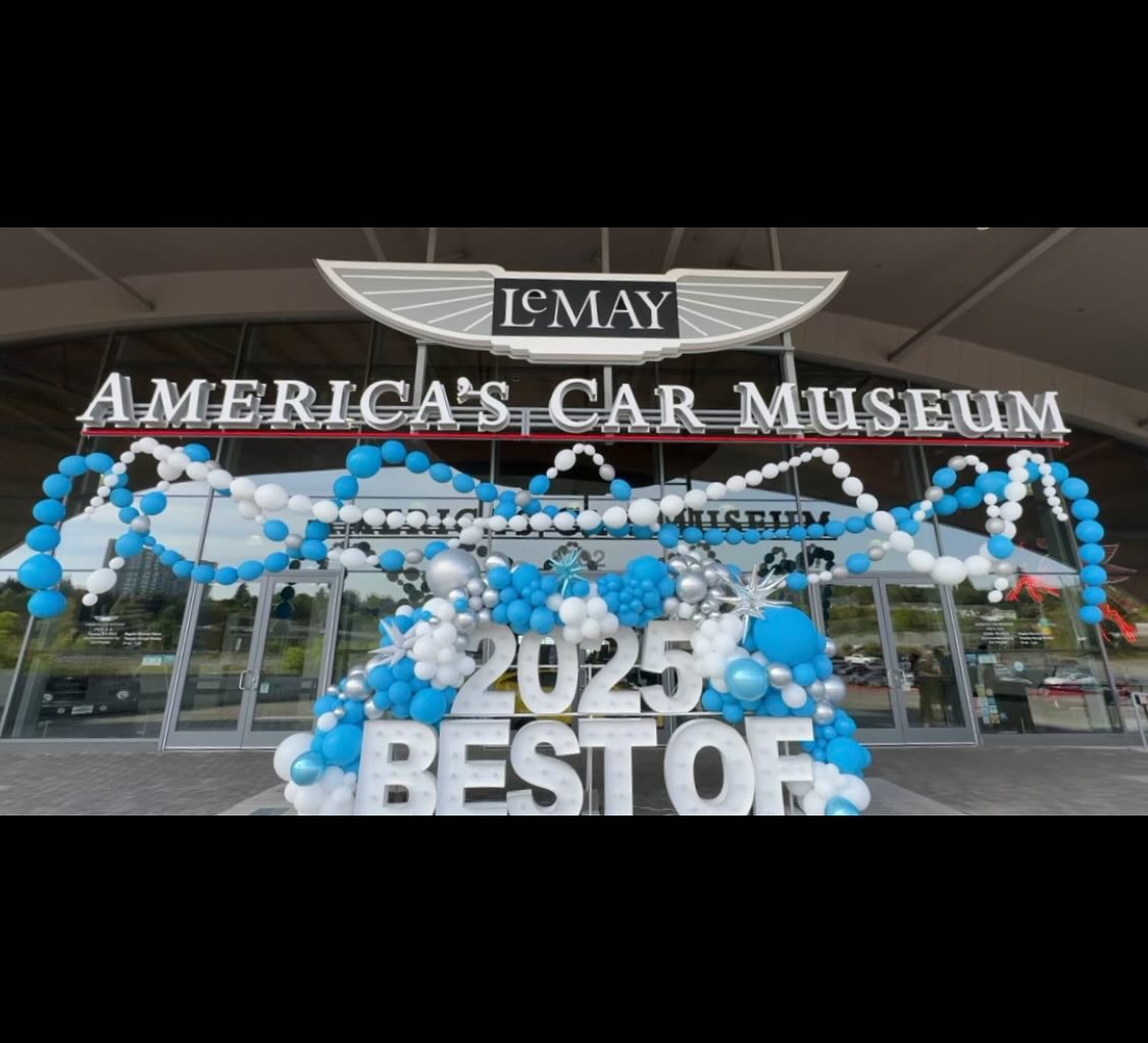 Large blue, white, and silver balloon installation at LeMay America’s Car Museum